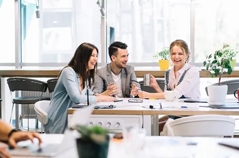 Professional team discussing healthcare solutions at NuReady Health Network, promoting collaborative patient care and integrated health services.