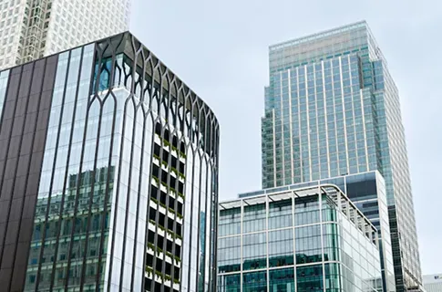 NuReady Health Network modern healthcare facility with skyscrapers and glass buildings in a cityscape, emphasizing innovative healthcare solutions and professional healthcare services.