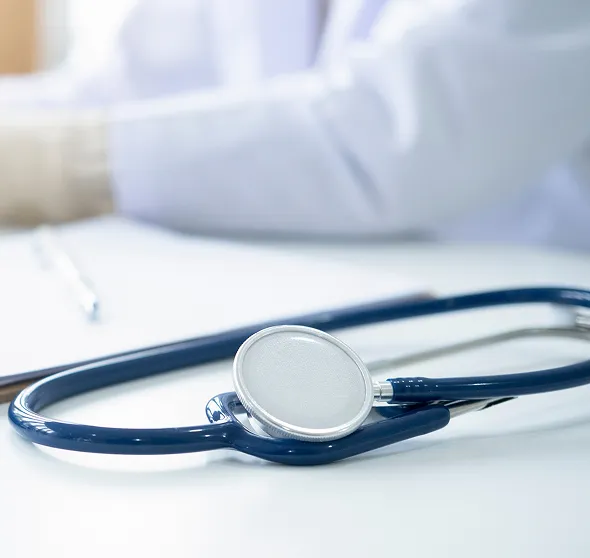 Stethoscope on a medical table representing NuReady Health Network's healthcare and medical provider services.