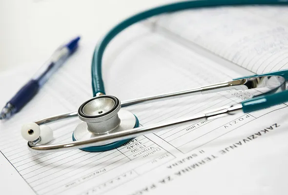 Stethoscope resting on medical documents, representing healthcare services and medical professional readiness at NuReady Health Network.